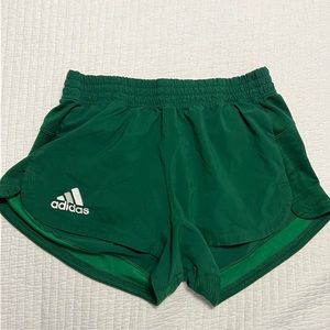 Green Adidas running shorts